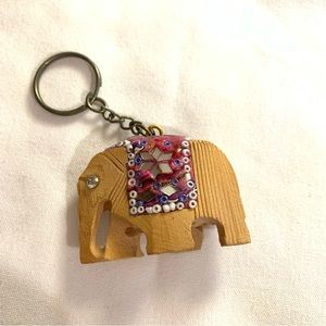 Wooden embellished elephant key chain.
